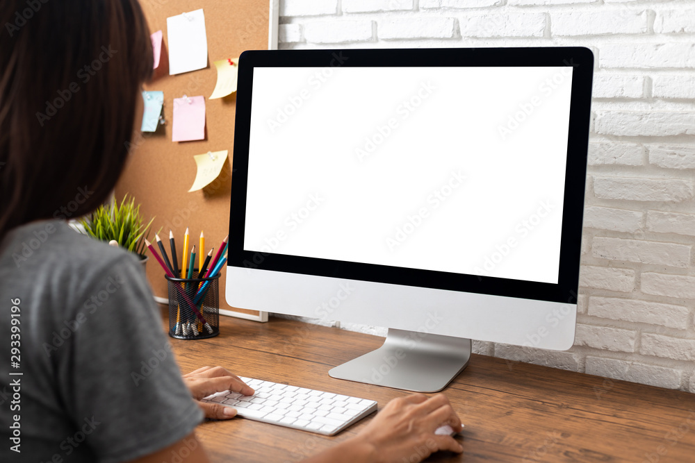 A woman using a computer.